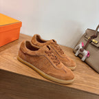 Suede sneakers in tan, lace-up with side swoosh-style panel and beige sole edge