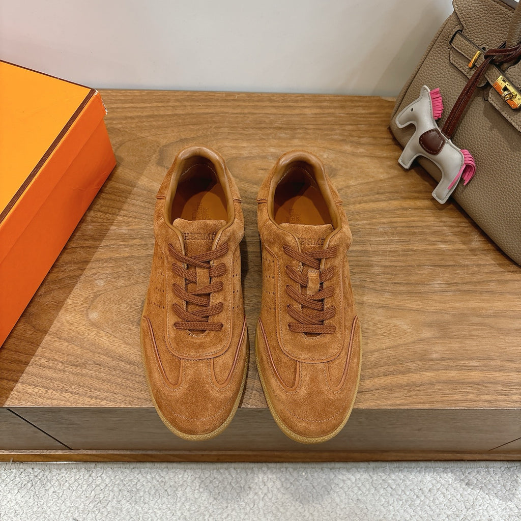 Suede sneakers in tan, lace-up design with perforated toe and classic side swoosh detail