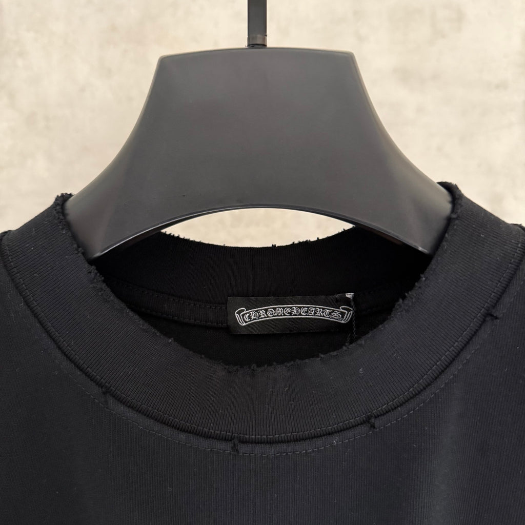 Black long-sleeve crewneck shirt neckline with inside brand label