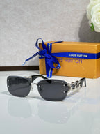 Louis Vuitton sunglasses, dark lenses with black frame and gold chain-link detail