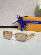 Louis Vuitton sunglasses, gold frame with light tinted lenses and metal link detail