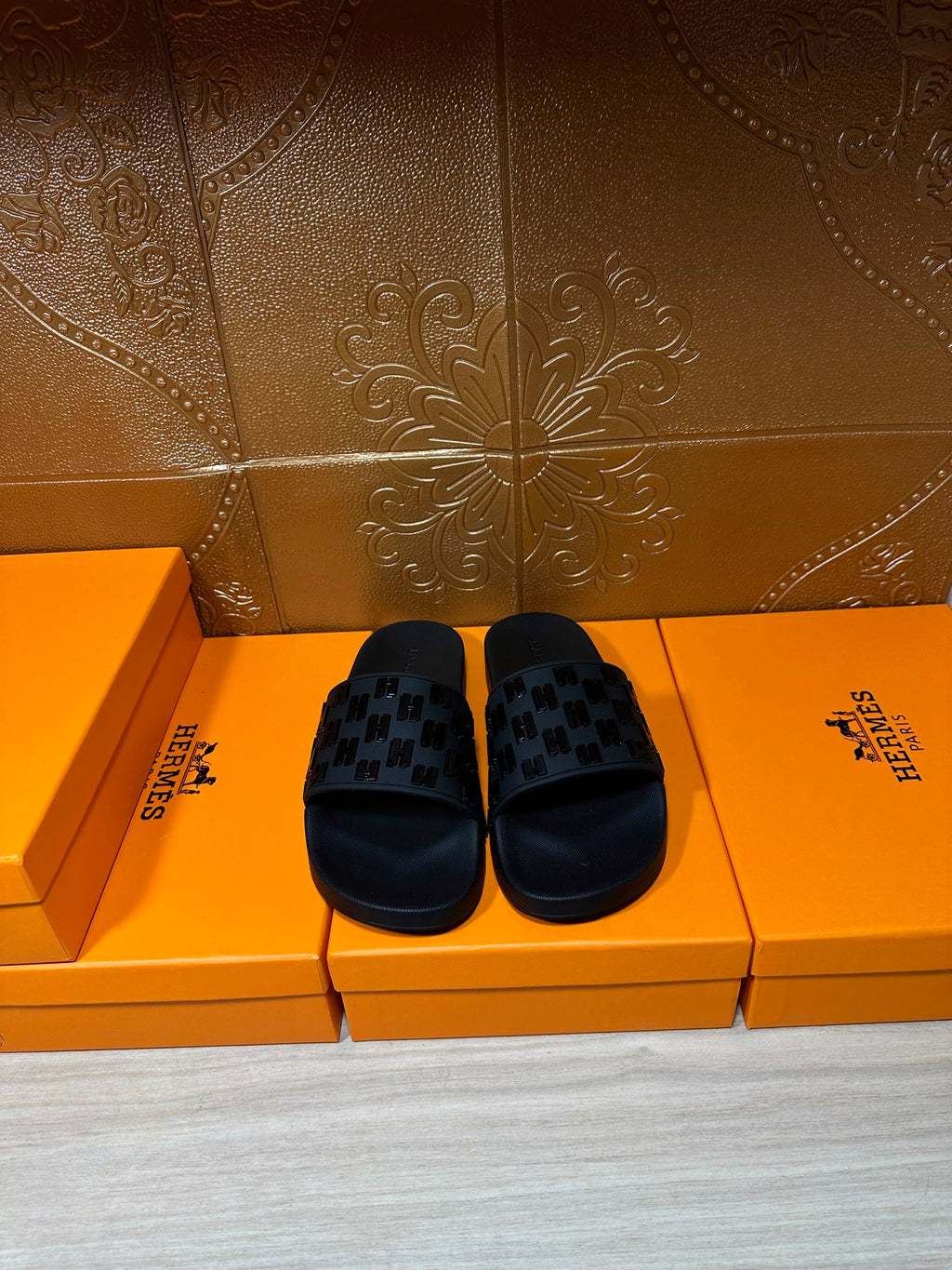 Hermes black slide sandals with patterned strap detail