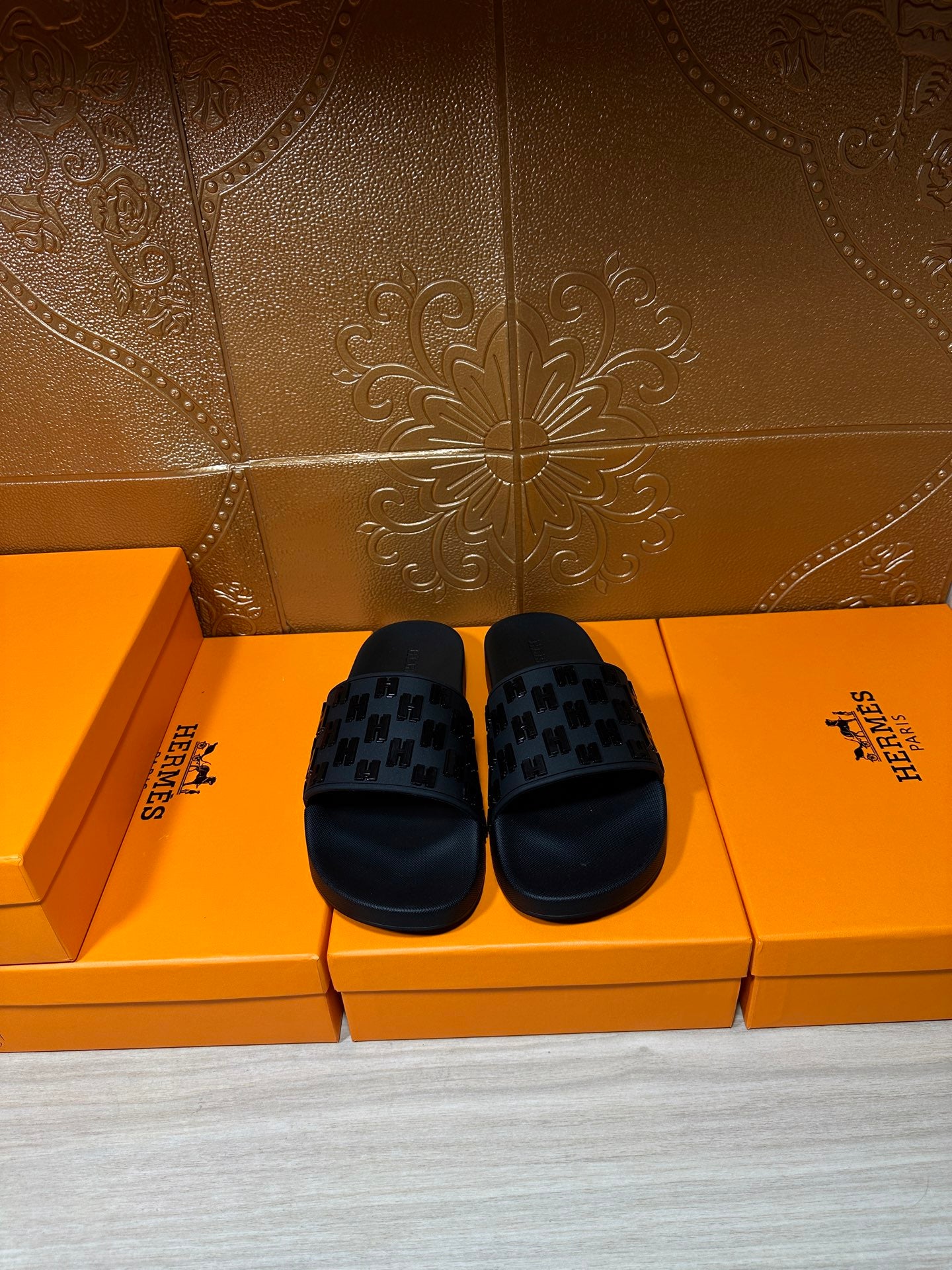 Hermes black slide sandals with patterned strap detail