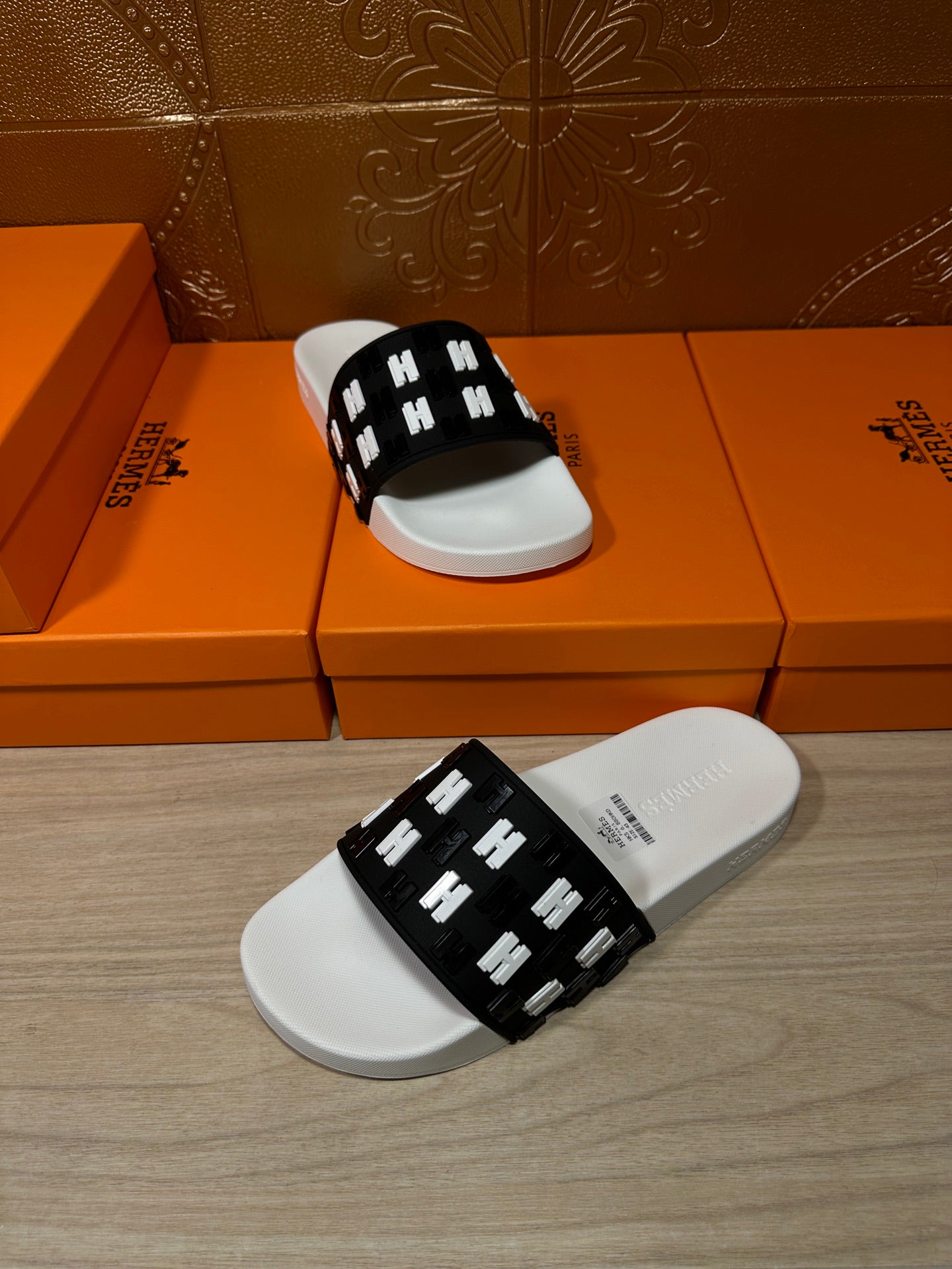 Hermes slide sandals set, black H-pattern strap on white footbeds