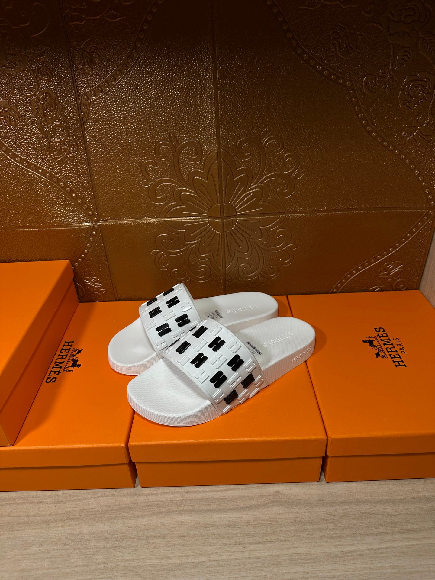 Hermes sandals, white slide with black H logo strap, side view