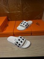 Hermes sandals, white slide with black H logo strap, pair view