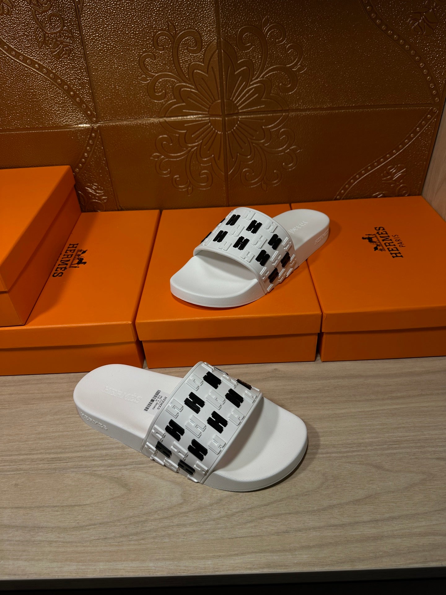 Hermes sandals, white slide with black H logo strap, pair view