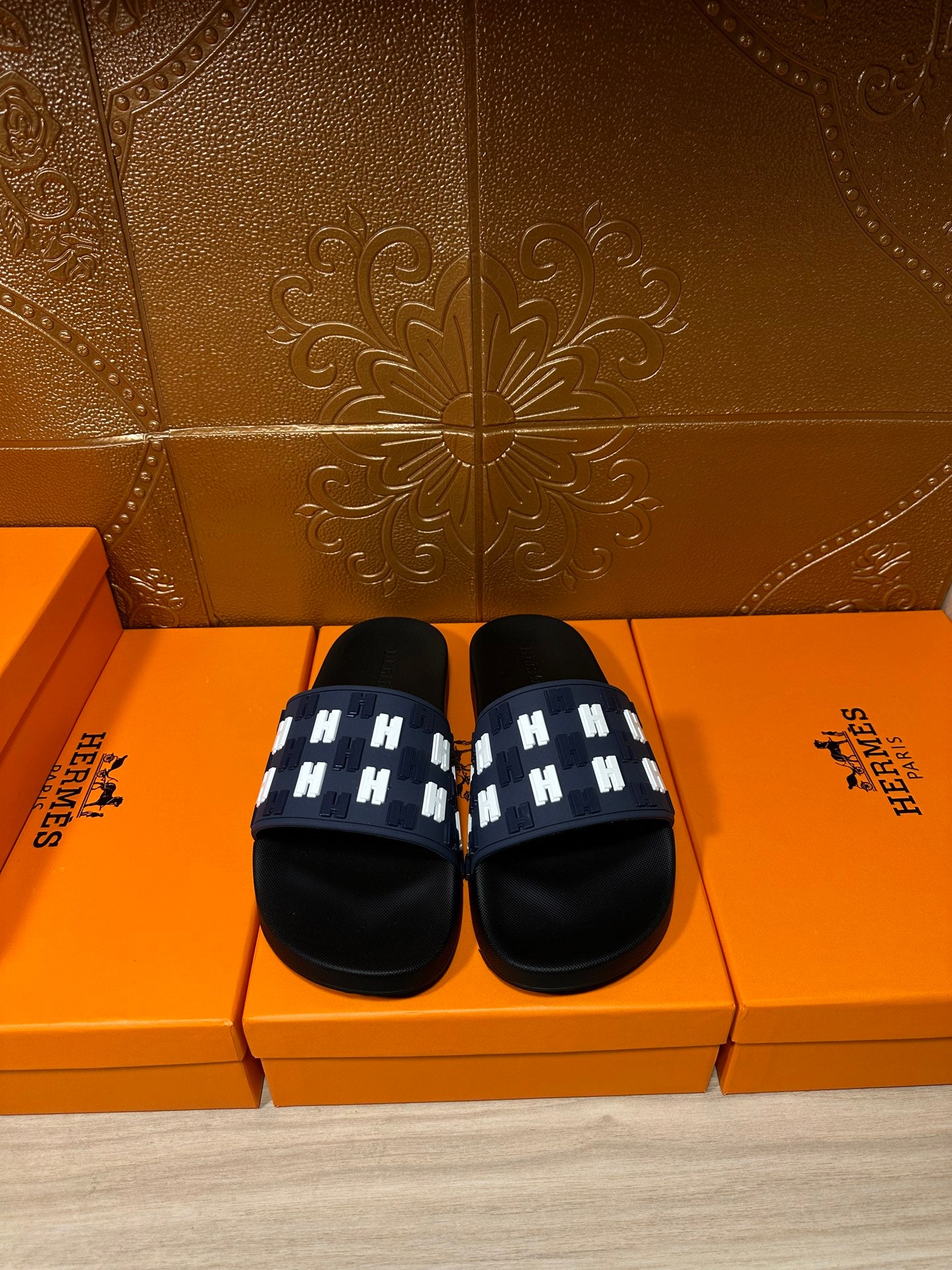 Hermes black sandals with navy strap and white H-pattern