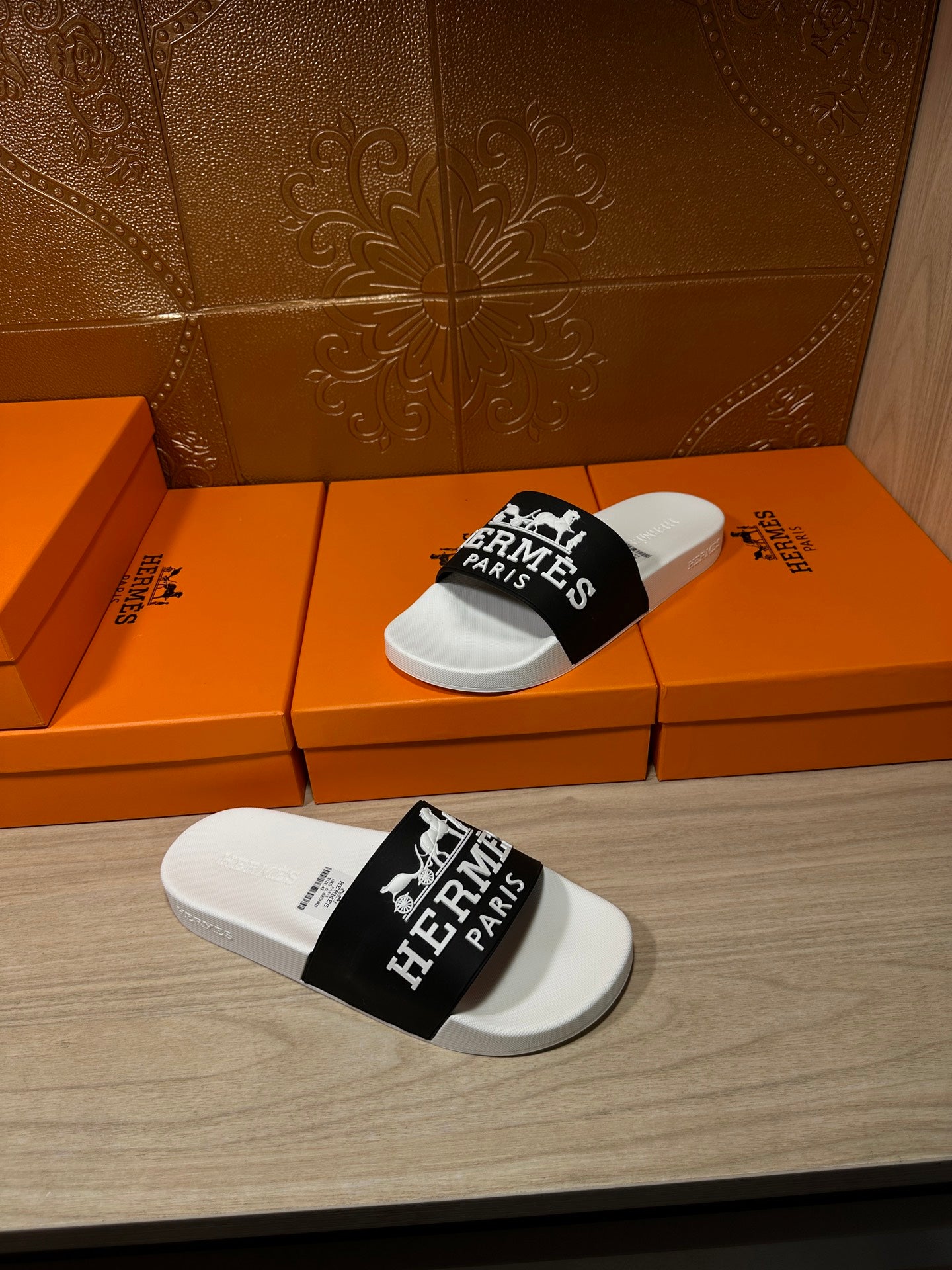 Hermes slide sandal pair, white footbeds with black logo band