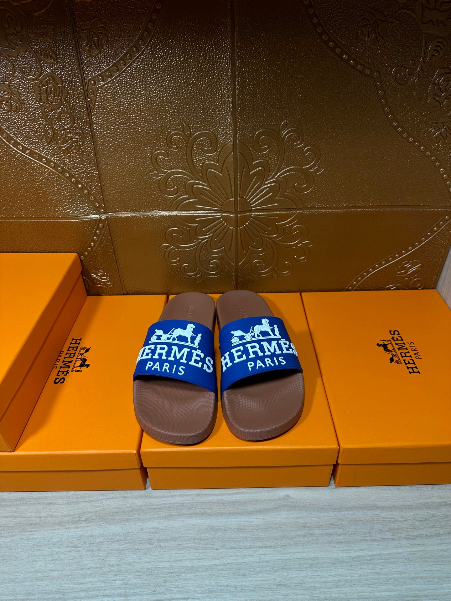 Brown slide sandals with blue Hermes Paris strap
