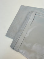 Light blue shorts with textured stripe detail on the hem, laid flat
