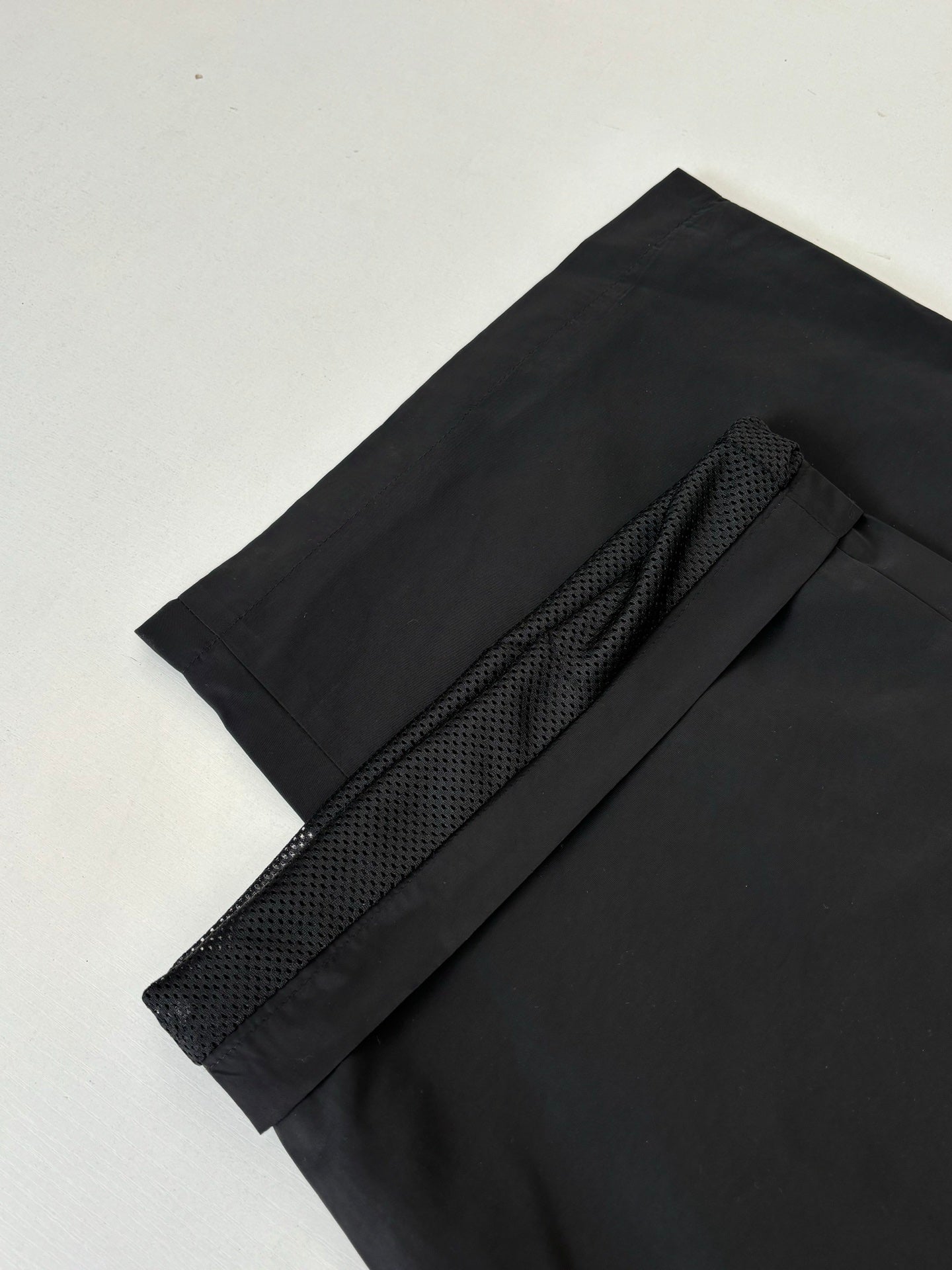 Black Balenciaga track pants detail, textured side stripe and stitched seam