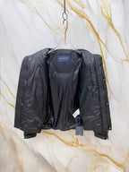 Dark gray puffer jacket interior view with blue neck label and open front