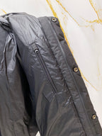 Dark gray puffer jacket side with long zipper and snap button placket