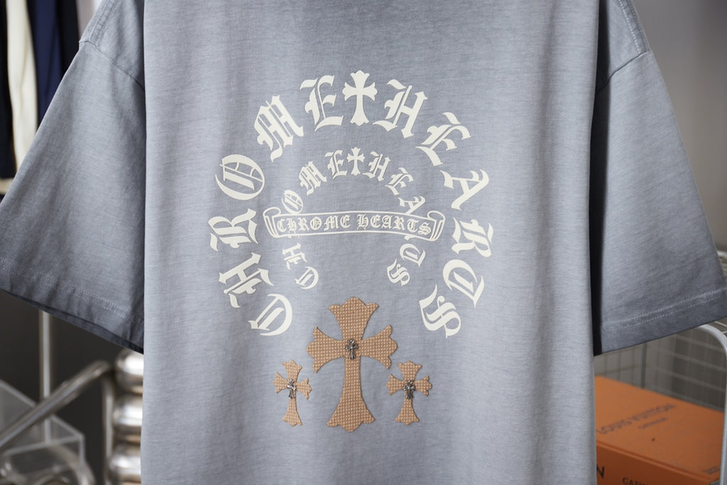 Light blue short-sleeve T-shirt back with large circular cross graphic