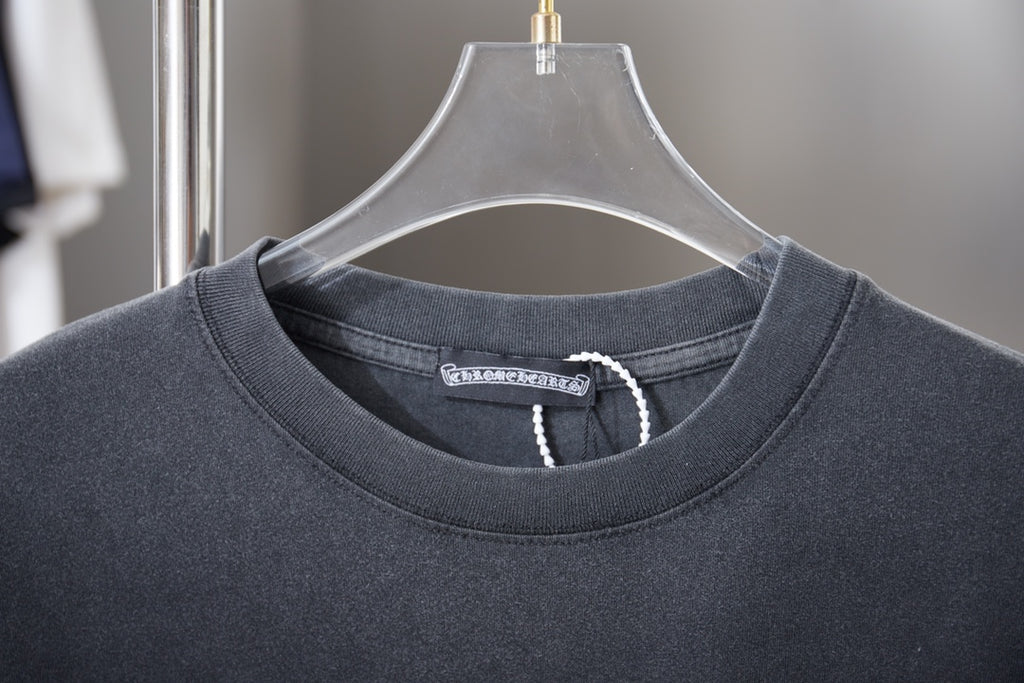 Dark gray crewneck T-shirt collar with woven brand tag