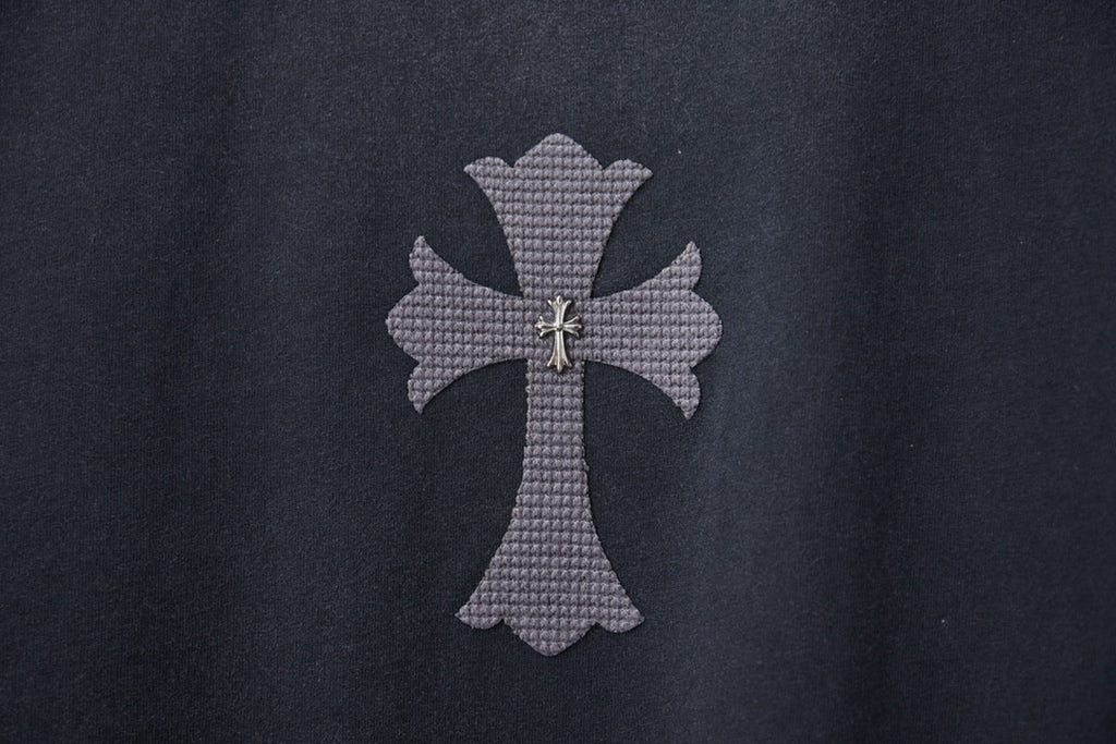 Dark gray T-shirt featuring a small cross emblem applique