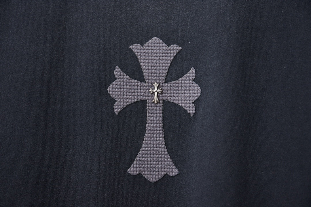 Dark gray T-shirt featuring a small cross emblem applique