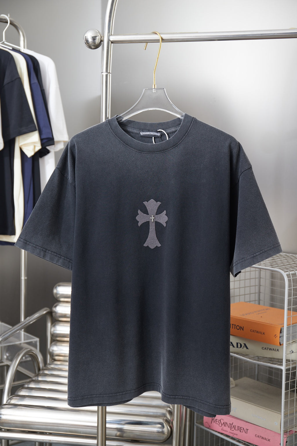 Dark gray short-sleeve T-shirt with a cross emblem on the chest
