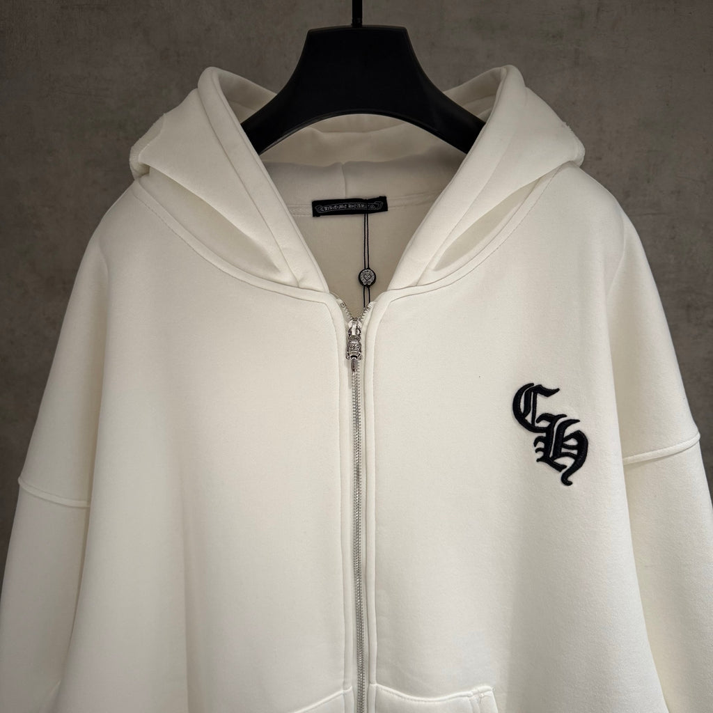 White zip-up hoodie with hood, front zipper, and black chest emblem