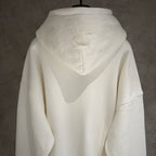 White zip-up hoodie back view with hood and embroidered heart-like logo