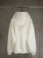 White zip-up hoodie with hood and kangaroo pocket; back view shows no chest logo