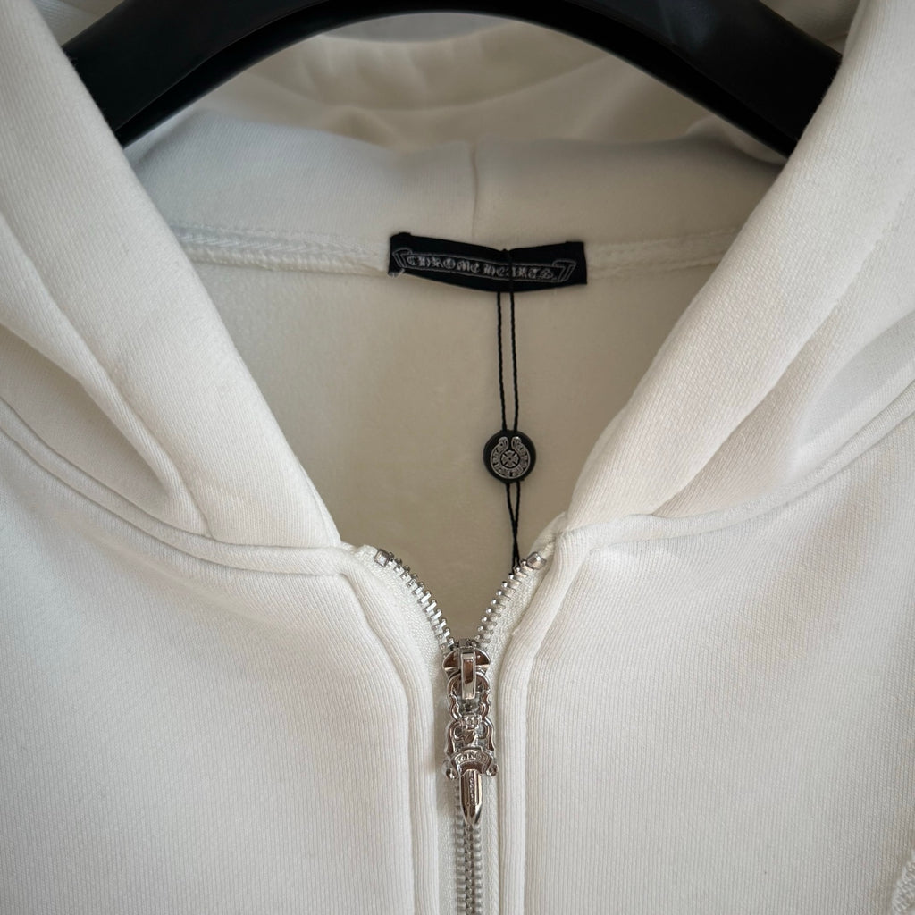 White zip-up hoodie hood with black inner label and silver-tone zipper pulls