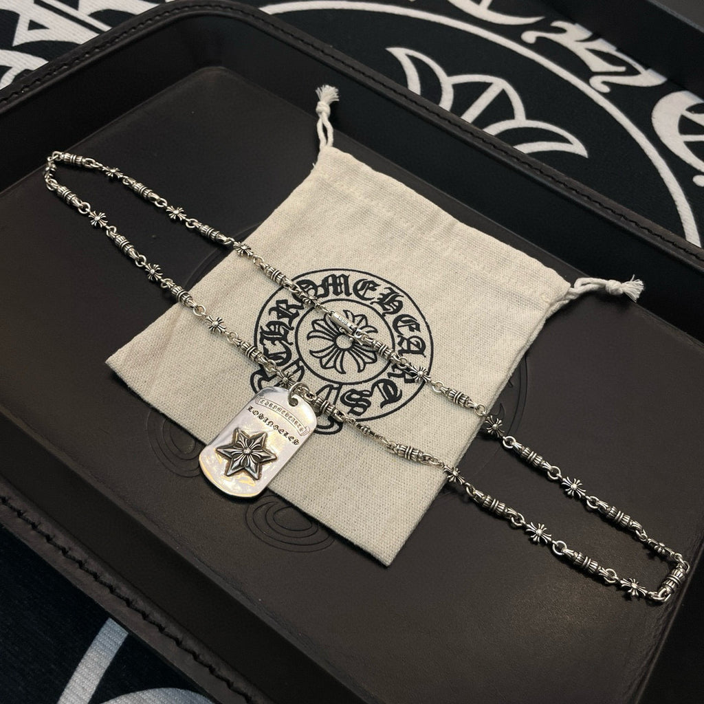 Necklace with silver-tone chain and rectangular star pendant in fabric pouch