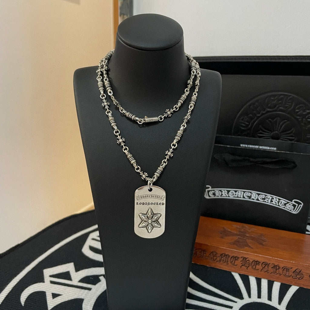 Necklace with layered silver-tone chains and rectangular pendant with star emblem