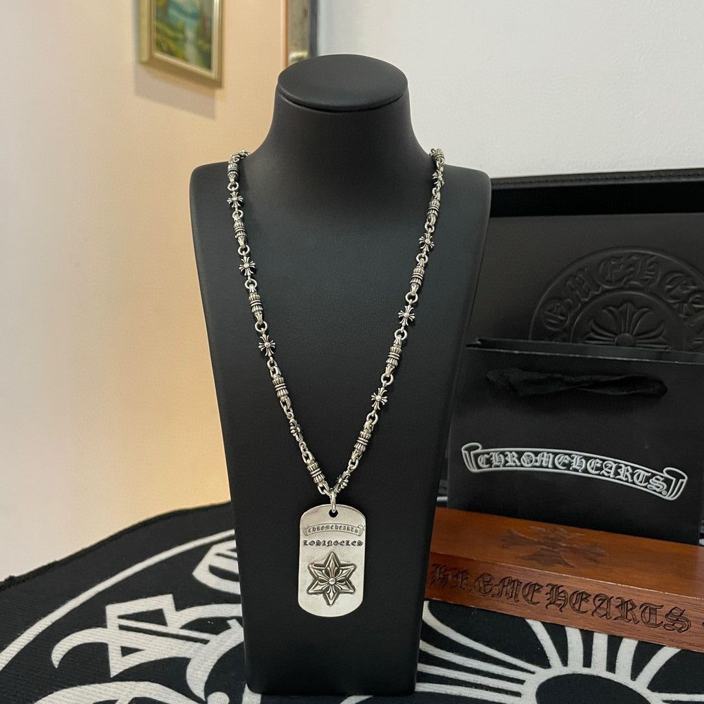 Necklace with silver-tone chain, rectangular tag pendant, and star emblem on stand