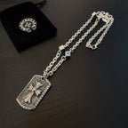 Silver-tone chain necklace with rectangular cross pendant and matching chain length