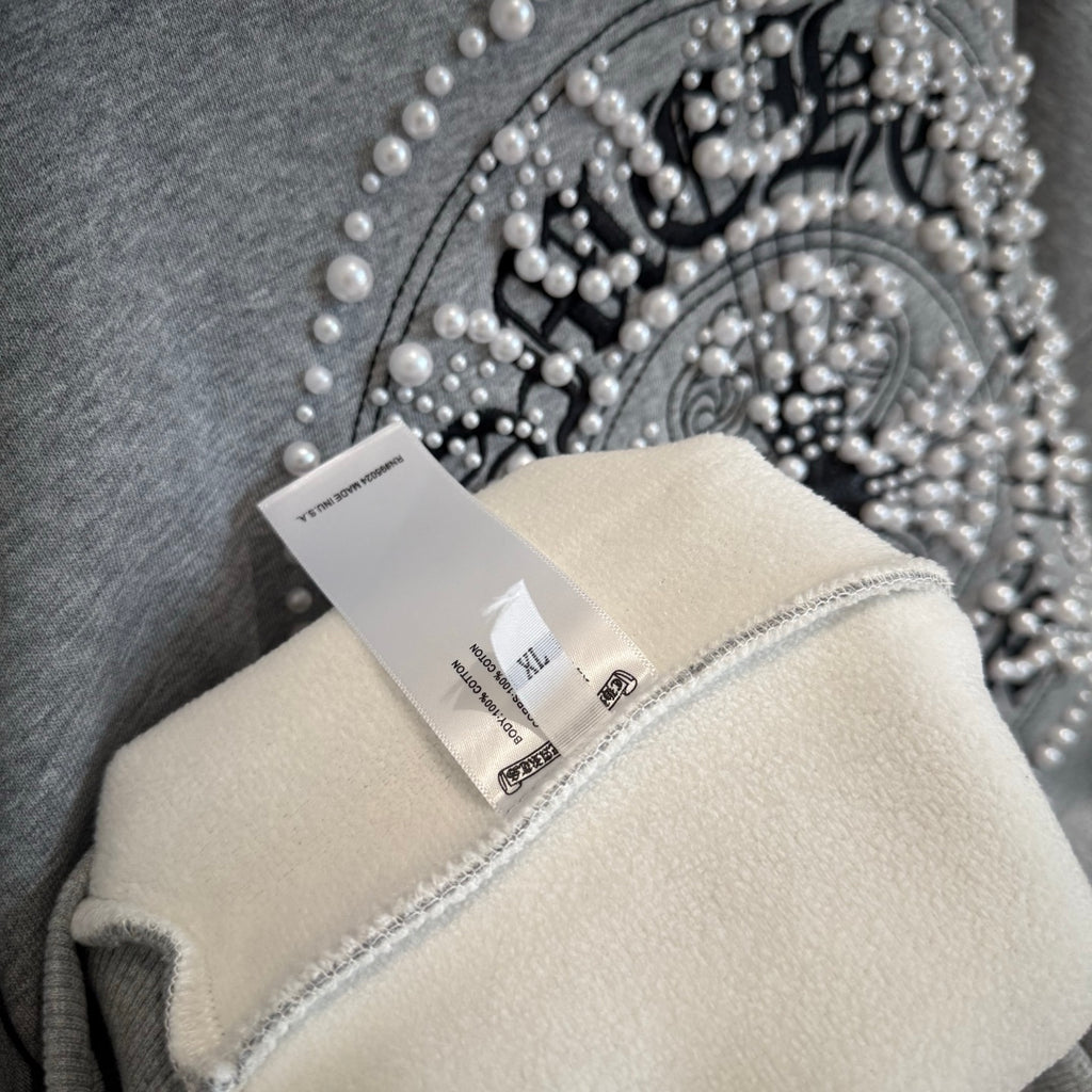 Light gray hoodie hood lining with pearl-like bead graphic on outer fabric