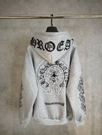 Light gray zip hoodie with large back graphic and rhinestone-style angel emblem