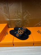Hermes black slide sandals with orange logo strap band