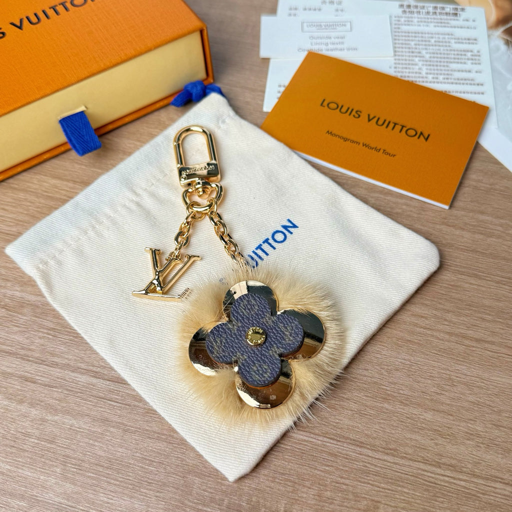 Louis Vuitton flower charm keychain with blue monogram leather and gold chain