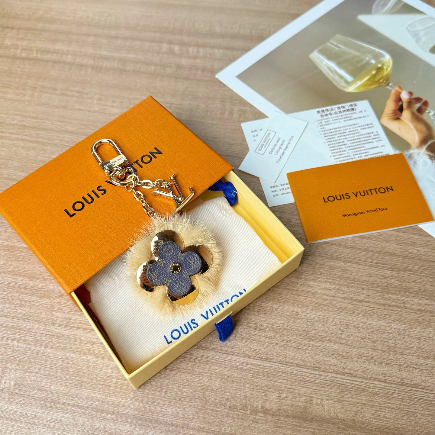 Louis Vuitton charm keychain in gift box with blue flower leather and gold chain