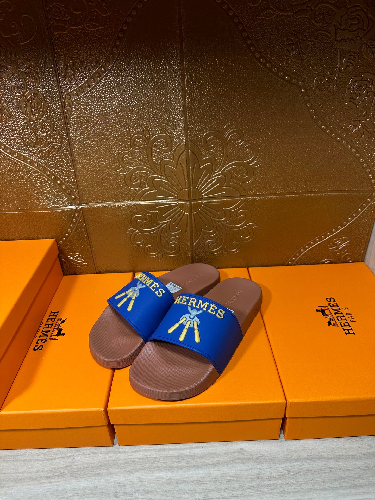 Hermès slide sandals, two matching blue straps over tan footbeds