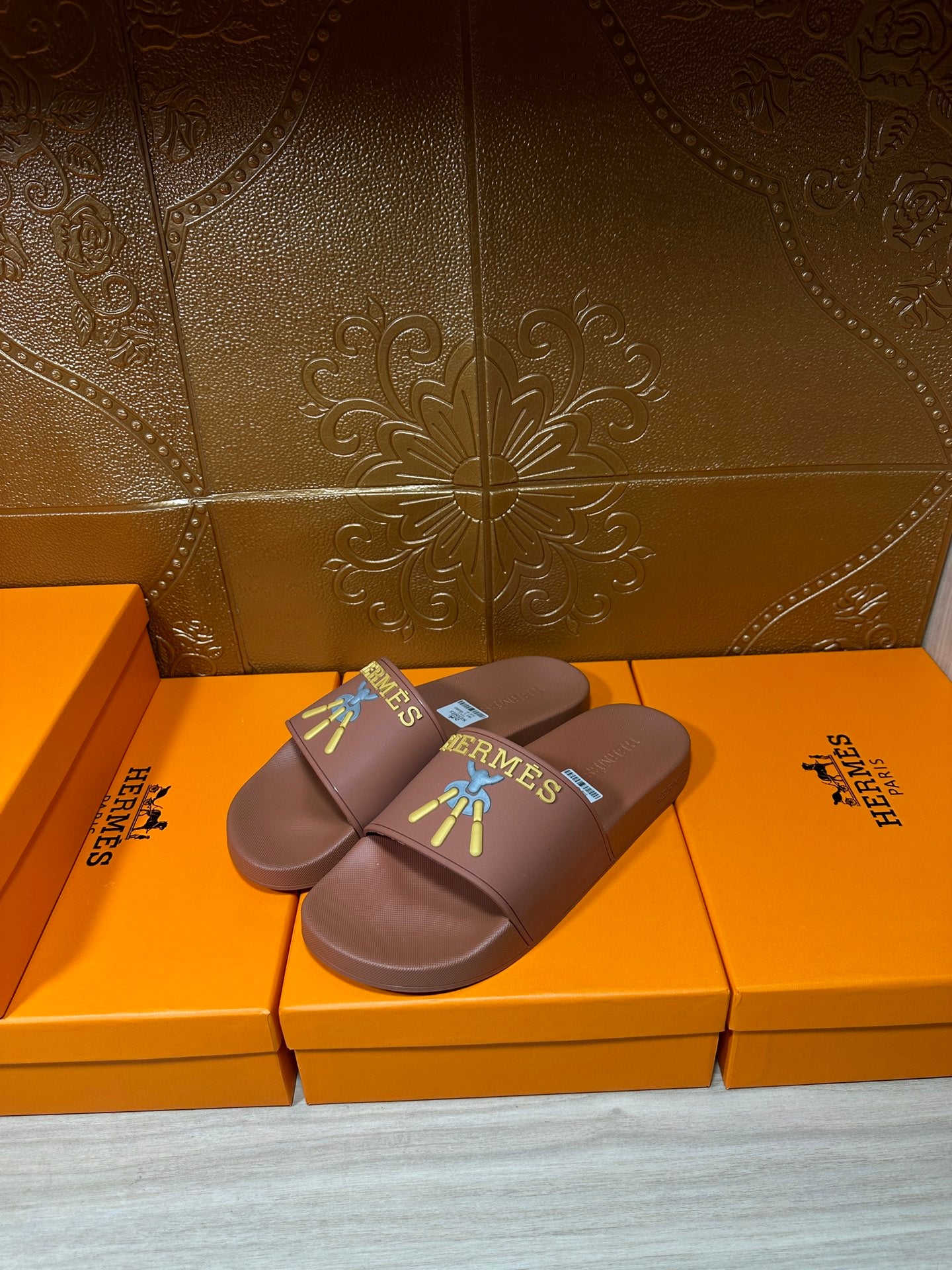 Hermes slide sandals in taupe, single pair with multicolor logo patch, curved sole