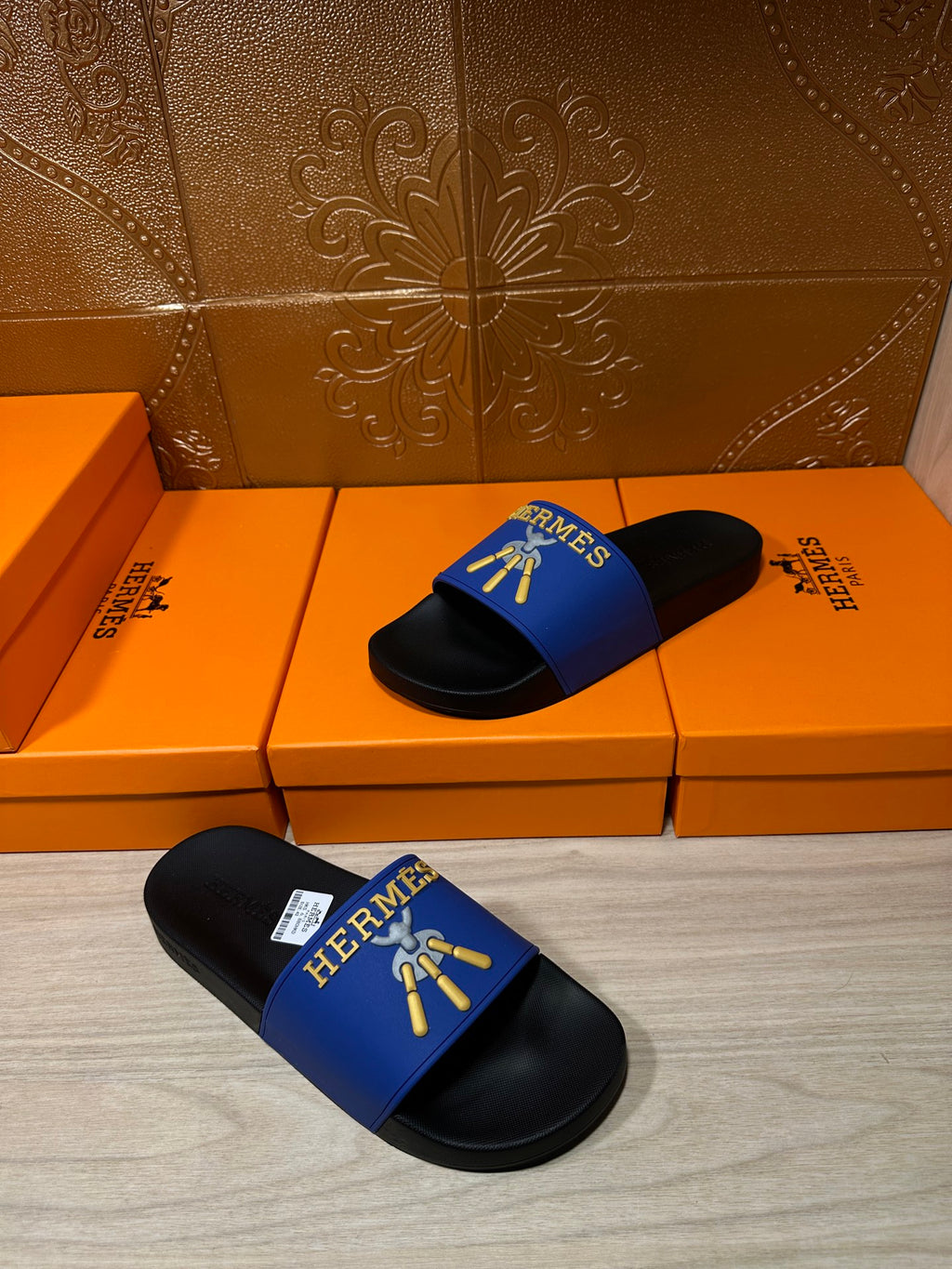 Hermes slide sandals, blue band with gold emblem and black footbeds