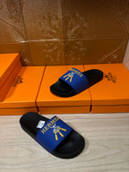 Hermes slide sandals, blue band with gold emblem and black footbeds
