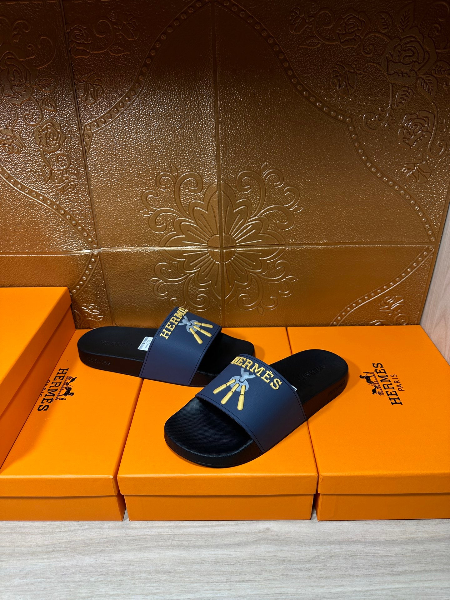 Hermes slide sandals, blue band with gold Hermes motif on dark footbed
