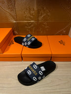 Hermes black slide sandals with navy strap and white H logos