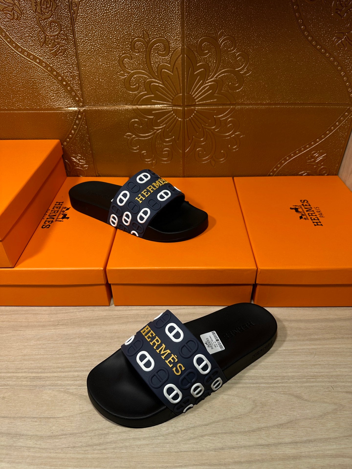 Hermes black slide sandals with navy strap and white H logos