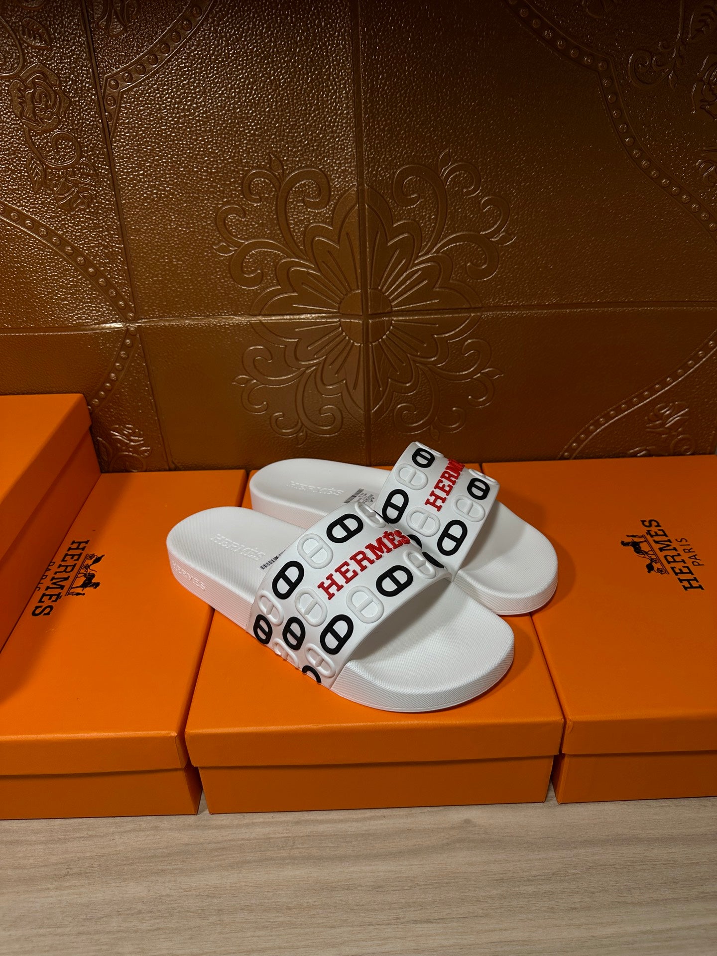 Hermes white slide sandals with wide logo strap and smooth slide sole