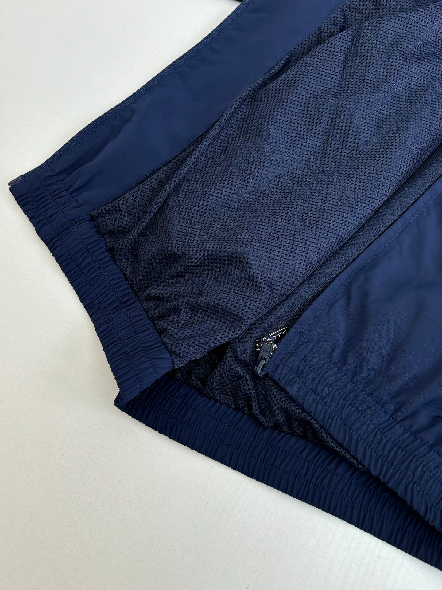 Balenciaga navy windbreaker interior mesh lining with elastic cuff