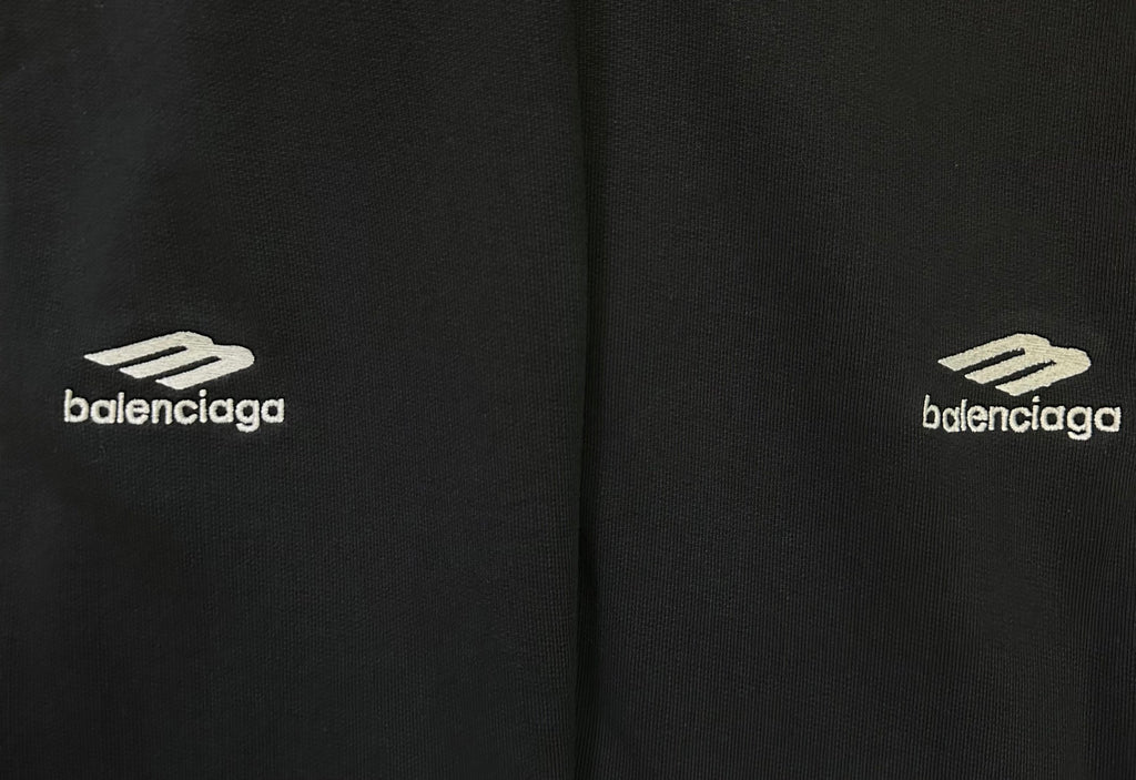Black pants with Balenciaga logo print on side