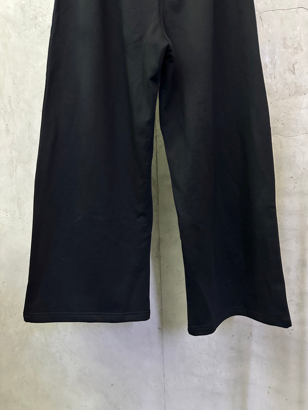 Black wide-leg pants with relaxed straight legs