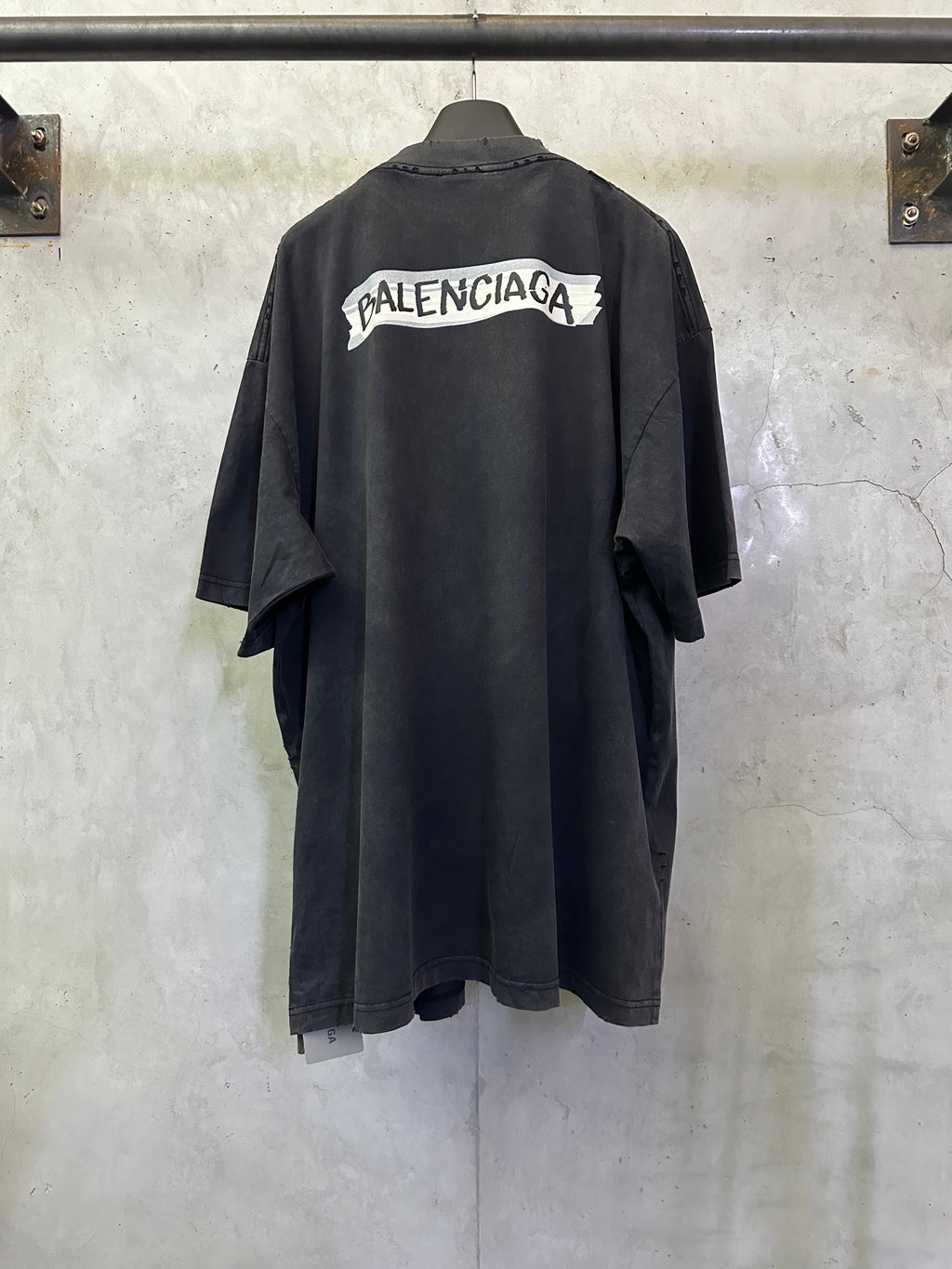 Dark charcoal short-sleeve T-shirt with Balenciaga logo patch on back yoke