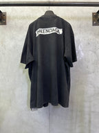Dark charcoal short-sleeve T-shirt with Balenciaga logo patch on back yoke