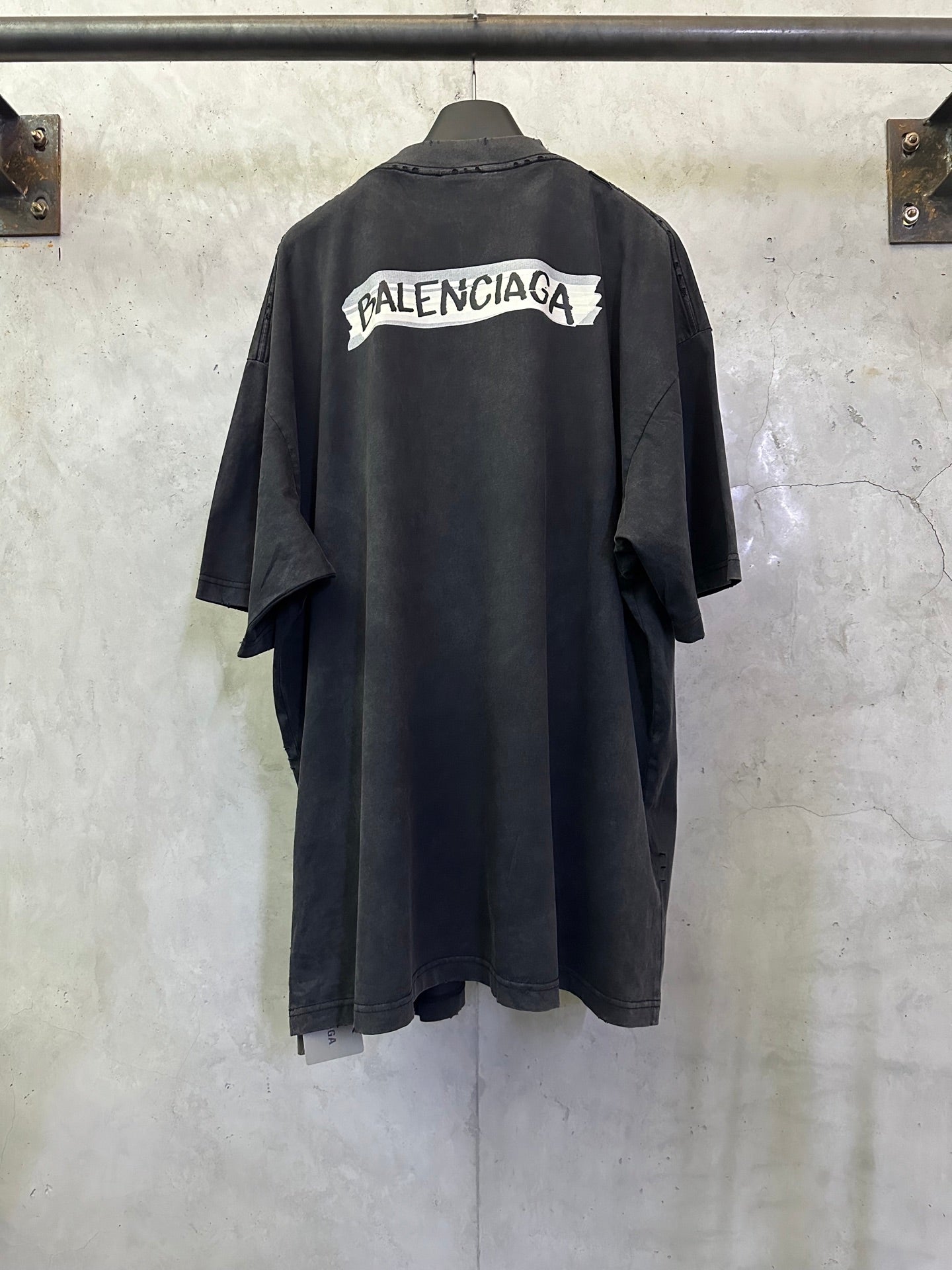 Dark charcoal short-sleeve T-shirt with Balenciaga logo patch on back yoke